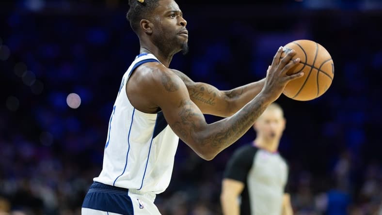 Mar 29, 2023; Philadelphia, Pennsylvania, USA; Dallas Mavericks forward Reggie Bullock (25) shoots the ball against the Philadelphia 76ers during the second quarter at Wells Fargo Center. Mandatory Credit: Bill Streicher-USA TODAY Sports