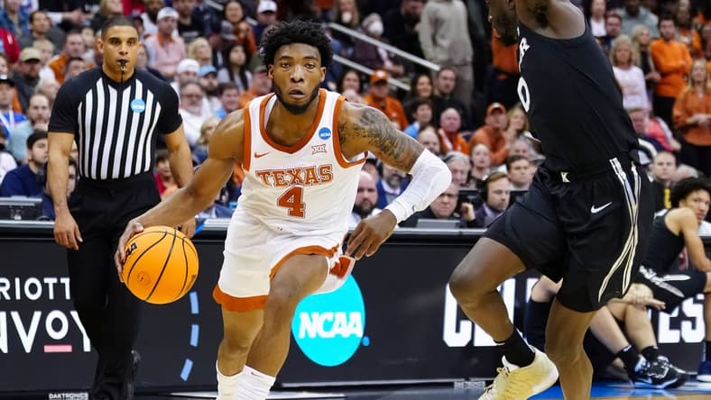 Mar 24, 2023; Kansas City, MO, USA; Texas Longhorns guard Tyrese Hunter (4) dribbles the ball against Xavier Musketeers guard Souley Boum (0) during the first half of an NCAA tournament Midwest Regional semifinal at T-Mobile Center. Mandatory Credit: Jay Biggerstaff-USA TODAY Sports