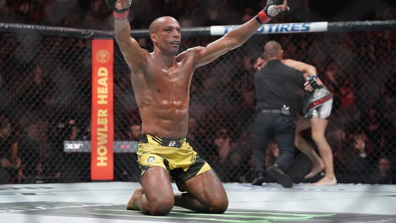 Apr 15, 2023; Kansas City, Missouri, USA; Edson Barboza (red gloves) reacts after the fight against Billy Quarantillo (blue gloves) during UFC Fight Night at T-Mobile Center. Mandatory Credit: Denny Medley-USA TODAY Sports