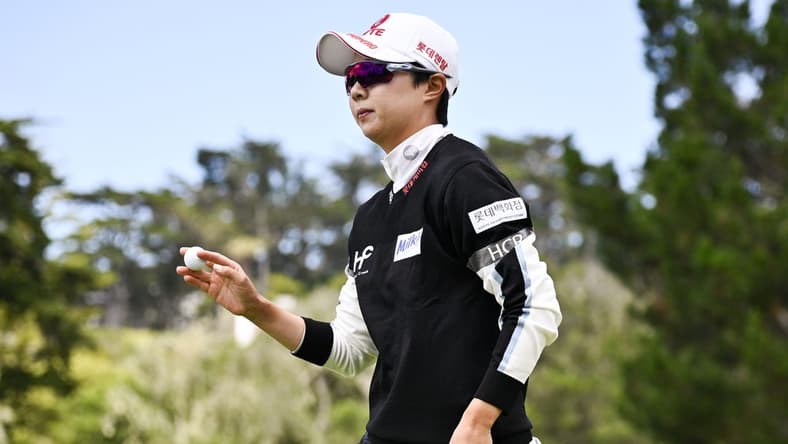 Jul 9, 2023; Pebble Beach, California, USA; Hyo Joo Kim acknowledges the crowd after her putt on the second hole during the final round of the U.S. Women's Open golf tournament at Pebble Beach Golf Links. Mandatory Credit: Kelvin Kuo-USA TODAY Sports