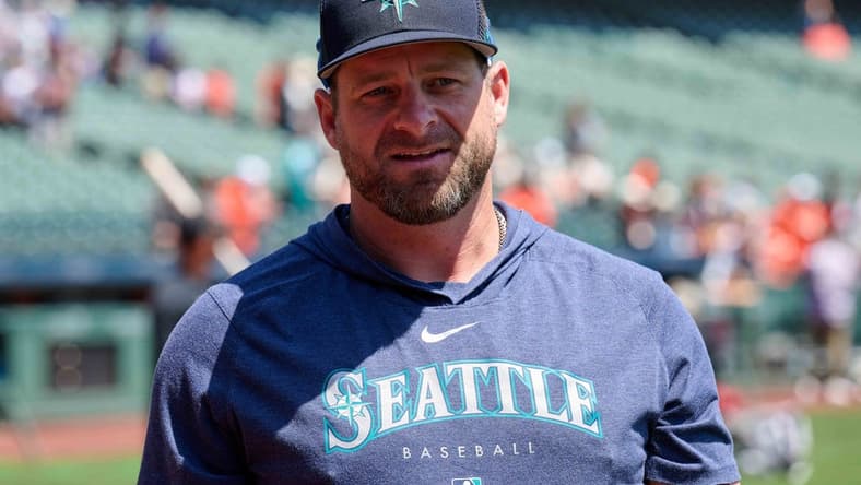 Jul 4, 2023; San Francisco, California, USA; Seattle Mariners bullpen coach and quality control coach Stephen Vogt (13) walks on the field before the game against the San Francisco Giants at Oracle Park. Mandatory Credit: Robert Edwards-USA TODAY Sports
