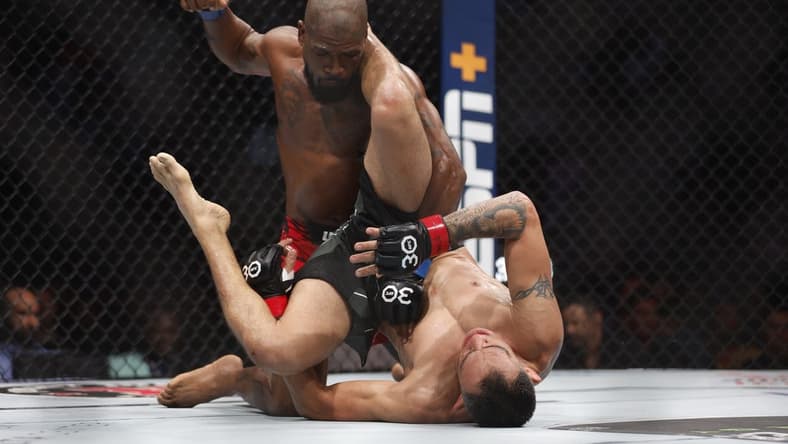 Jul 29, 2023; Salt Lake City, Utah, USA; Tony Ferguson (red gloves) fights Bobby Green (blue gloves) during UFC 291 at Delta Center. Mandatory Credit: Jeff Swinger-USA TODAY Sports
