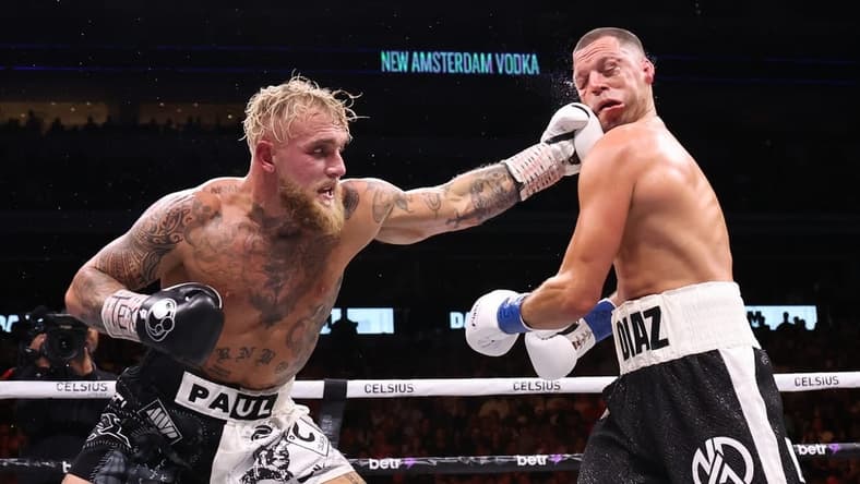 Aug 5, 2023; Dallas, Texas, USA; Jake Paul (left) fights against Nate Diaz in a boxing match at American Airlines Center. Mandatory Credit: Kevin Jairaj-USA TODAY Sports
