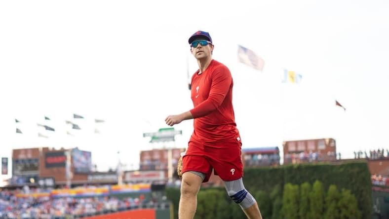 Aug 8, 2023; Philadelphia, Pennsylvania, USA; Philadelphia Phillies Rhys Hoskins walks the field while on injured reserve before a game against the Washington Nationals at Citizens Bank Park. Mandatory Credit: Bill Streicher-USA TODAY Sports