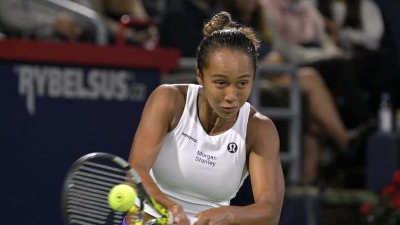 Aug 10, 2023; Montreal, Quebec, Canada; Leylah Fernandez (CAN) hits a backhand against Danielle Collins (USA) (not pictured) during third round play at IGA Stadium. Mandatory Credit: Eric Bolte-USA TODAY Sports