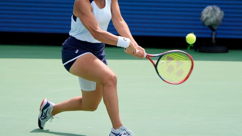 Jasmine Paolini of Italy makes a hit to Coco Gauff of the U.S. during the quarterfinals of the Western & Southern Open at the Lindner Family Tennis Center in Mason Friday, August, 18, 2023.
