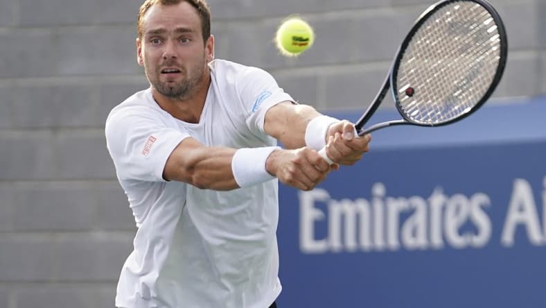 Aug 30, 2023; Flushing, NY, USA; Roman Safiullin hits to Tommy Paul of the United States on day three of the 2023 U.S. Open tennis tournament at USTA Billie Jean King National Tennis Center. Mandatory Credit: Danielle Parhizkaran-USA TODAY Sports