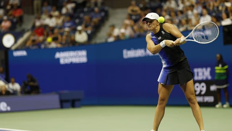 Sep 3, 2023; Flushing, NY, USA; Iga Swiatek of Poland hits a backhand against Jelena Ostapenko of Latvia (not pictured) on day seven of the 2023 U.S. Open tennis tournament at USTA Billie Jean King National Tennis Center. Mandatory Credit: Geoff Burke-USA TODAY Sports