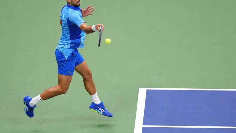 Sep 10, 2023; Flushing, NY, USA; Novak Djokovic of Serbia hits a forehand against Daniil Medvedev (not pictured) in the men's singles final in the men's singles final on day fourteen of the 2023 U.S. Open tennis tournament at USTA Billie Jean King National Tennis Center. Mandatory Credit: Danielle Parhizkaran-USA TODAY Sports