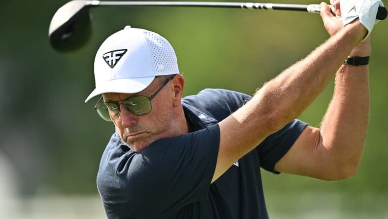 Sep 22, 2023; Sugar Grove, Illinois, USA; Phil Mickelson hits balls on the range during the first round of the LIV Golf Chicago golf tournament at Rich Harvest Farms. Mandatory Credit: Jamie Sabau-USA TODAY Sports