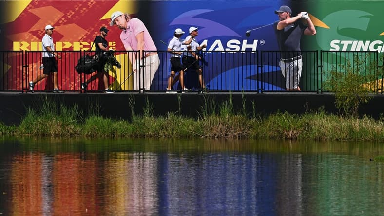 Sep 23, 2023; Sugar Grove, Illinois, USA; Sihwan Kim (far left) and James Piot and Phil Mickelson cross a bridge to the 17th green during the second round of the LIV Golf Chicago golf tournament at Rich Harvest Farms. Mandatory Credit: Jamie Sabau-USA TODAY Sports
