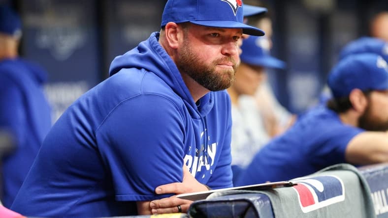 Sep 23, 2023; St. Petersburg, Florida, USA; Toronto Blue Jays manager John Schneider (14) looks on from the dugout against the Tampa Bay Rays in the eighth inning at Tropicana Field. Mandatory Credit: Nathan Ray Seebeck-USA TODAY Sports