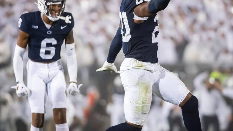 Penn State's Adisa Isaac celebrates after recovering a fumble during a White Out football game against Iowa Saturday, Sept. 23, 2023, in State College, Pa. The Nittany Lions shut out the Hawkeyes, 31-0.