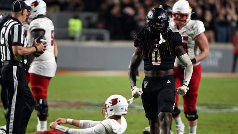 Sep 29, 2023; Raleigh, North Carolina, USA; North Carolina State Wolfpack safety Sean Brown (0) celebrates a sack during the second half against the Louisville Cardinals Mandatory Credit: Rob Kinnan-USA TODAY Sports at Carter-Finley Stadium. The Louisville Cardinals won 13-10.