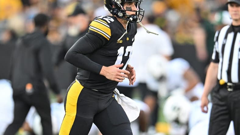 Sep 30, 2023; Iowa City, Iowa, USA; Iowa Hawkeyes quarterback Cade McNamara (12) warms up before the game against the Michigan State Spartans at Kinnick Stadium. Mandatory Credit: Jeffrey Becker-USA TODAY Sports