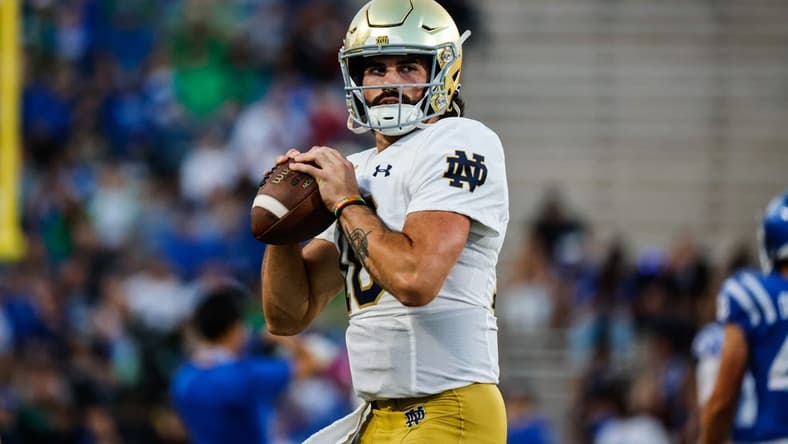 Sep 30, 2023; Durham, North Carolina, USA; Notre Dame Fighting Irish quarterback Sam Hartman (10) holds the football before the first half of the game against Duke Blue Devils at Wallace Wade Stadium. Mandatory Credit: Jaylynn Nash-USA TODAY Sports
