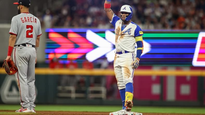Sep 30, 2023; Atlanta, Georgia, USA; Atlanta Braves right fielder Ronald Acuna Jr. (13) reacts after a double against the Washington Nationals in the fifth inning at Truist Park. Mandatory Credit: Brett Davis-USA TODAY Sports