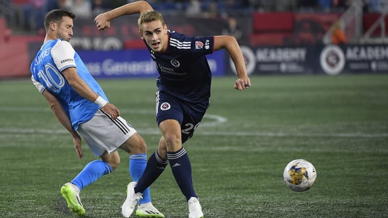 Sep 30, 2023; Foxborough, Massachusetts, USA; Charlotte FC midfielder Brecht Dejaegere (10) and New England Revolution midfielder Noel Buck (29) battle for the ball during the first half at Gillette Stadium. Mandatory Credit: Bob DeChiara-USA TODAY Sports