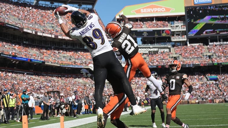 Oct 1, 2023; Cleveland, Ohio, USA; Baltimore Ravens tight end Mark Andrews (89) catches a touchdown as Cleveland Browns cornerback Denzel Ward (21) and safety Juan Thornhill (1) and cornerback Greg Newsome II (0) defend and during the first half at Cleveland Browns Stadium. Mandatory Credit: Ken Blaze-USA TODAY Sports