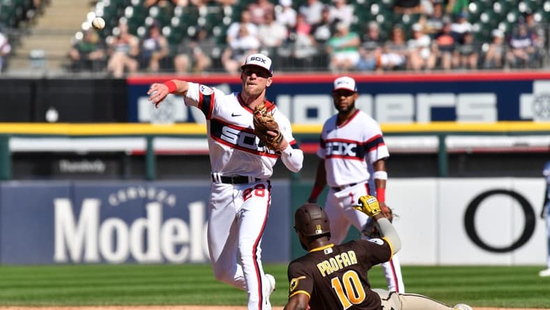 Oct 1, 2023; Chicago, Illinois, USA; Chicago White Sox second baseman Zach Remillard (28) completes a double play while forcing out San Diego Padres left fielder Jurickson Profar (10) during the second inning at Guaranteed Rate Field. Mandatory Credit: Patrick Gorski-USA TODAY Sports