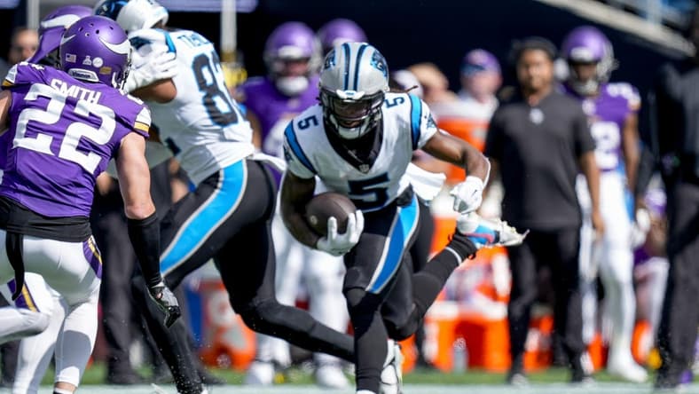 Oct 1, 2023; Charlotte, North Carolina, USA; Carolina Panthers wide receiver Laviska Shenault Jr. (5) runs for yards after catch against Minnesota Vikings safety Harrison Smith (22) during the second half at Bank of America Stadium. Mandatory Credit: Jim Dedmon-USA TODAY Sports