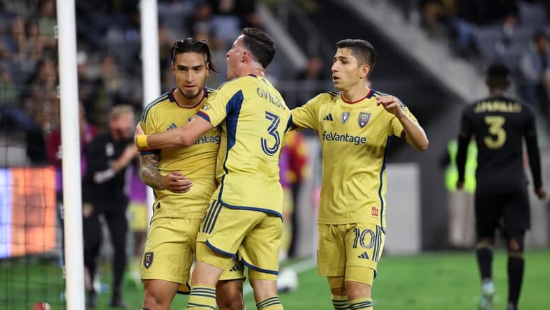 Oct 1, 2023; Los Angeles, California, USA;  Real Salt Lake forward Cristian Arango (9) celebrates with defender Bryan Oviedo (3) and forward Jefferson Savarino (10) after scoring a goal during the second half against the Los Angeles FC at BMO Stadium. Mandatory Credit: Kiyoshi Mio-USA TODAY Sports