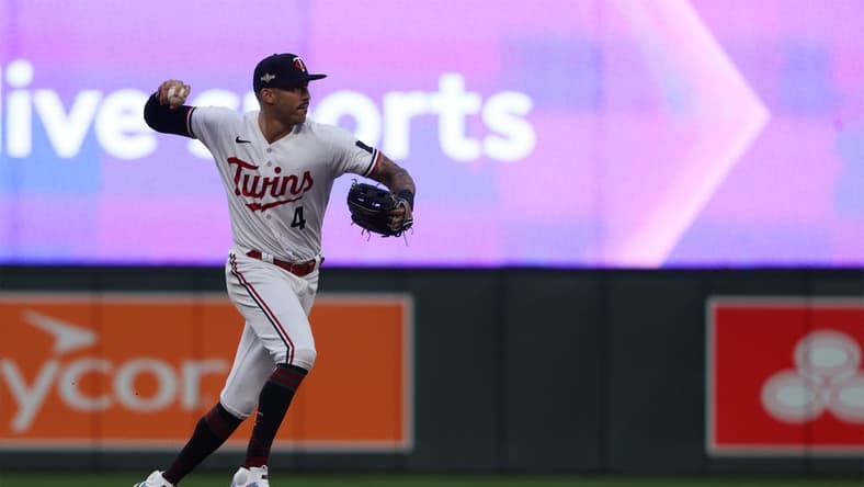Oct 4, 2023; Minneapolis, Minnesota, USA; Minnesota Twins shortstop Carlos Correa (4) throws to first for an out in the eighth inning against the Toronto Blue Jays during game two of the Wildcard series for the 2023 MLB playoffs at Target Field. Mandatory Credit: Jesse Johnson-USA TODAY Sports