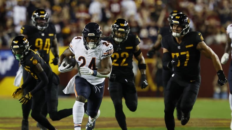 Oct 5, 2023; Landover, Maryland, USA; Chicago Bears running back Khalil Herbert (24) carries the ball as Washington Commanders linebacker Cody Barton (57) chases during the first quarter at FedExField. Mandatory Credit: Geoff Burke-USA TODAY Sports