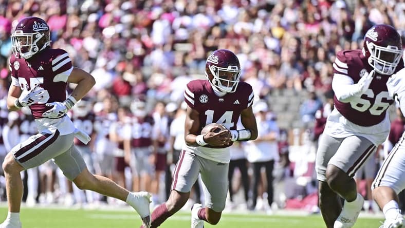 Oct 7, 2023; Starkville, Mississippi, USA; Mississippi State Bulldogs quarterback Mike Wright (14) runs the ball against the Western Michigan Broncos during the first quarter at Davis Wade Stadium at Scott Field. Mandatory Credit: Matt Bush-USA TODAY Sports