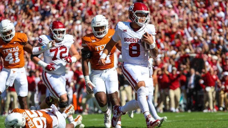 Oct 7, 2023; Dallas, Texas, USA;  Oklahoma Sooners quarterback Dillon Gabriel (8) runs for a touchdown during the first half against the Texas Longhorns at the Cotton Bowl. Mandatory Credit: Kevin Jairaj-USA TODAY Sports