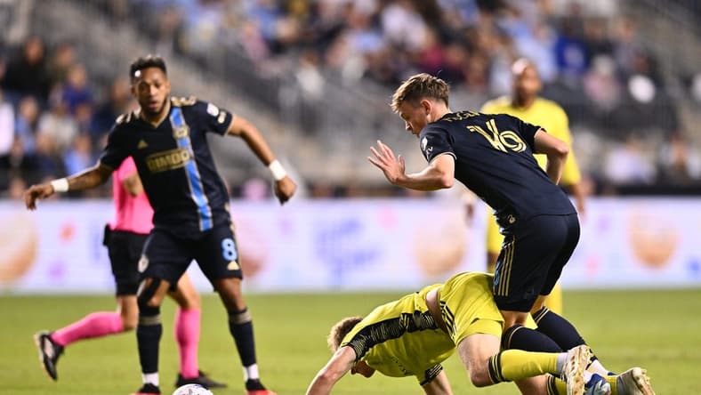 Oct 7, 2023; Philadelphia, Pennsylvania, USA; Philadelphia Union midfielder Jack McGlynn (16) and Nashville SC midfielder Dax McCarty (6) battle for position in the first half at Subaru Park. Mandatory Credit: Kyle Ross-USA TODAY Sports