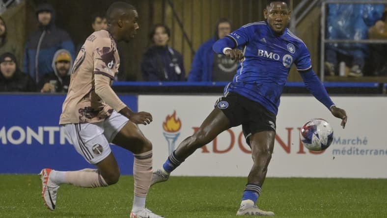 Oct 7, 2023; Montreal, Quebec, CAN; CF Montreal forward Romell Quioto (30) passes the ball against Portland Timbers defender Juan Mosquera (29) in the first half at Stade Saputo. Mandatory Credit: Eric Bolte-USA TODAY Sports