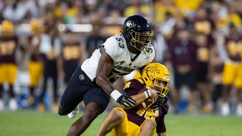 Oct 7, 2023; Tempe, Arizona, USA; Arizona State Sun Devils quarterback Trenton Bourguet (16) is sacked by Colorado Buffaloes defensive end Arden Walker (53) in the second half at Mountain America Stadium. Mandatory Credit: Mark J. Rebilas-USA TODAY Sports