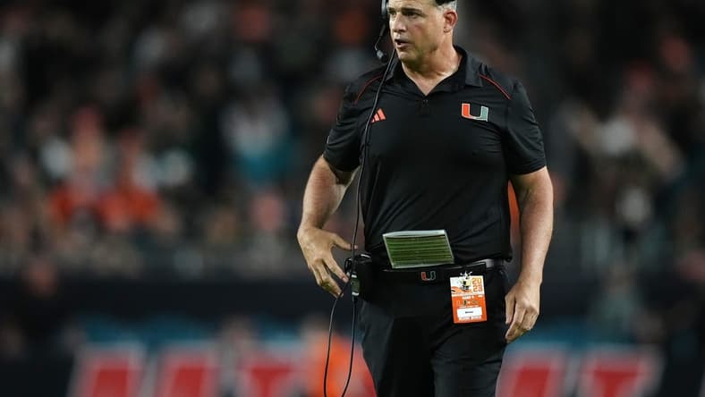 Oct 7, 2023; Miami Gardens, Florida, USA; Miami Hurricanes head coach Mario Cristobal walks on the field in the second half against the Georgia Tech Yellow Jackets at Hard Rock Stadium. Mandatory Credit: Jasen Vinlove-USA TODAY Sports
