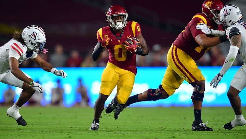 Oct 7, 2023; Los Angeles, California, USA; Southern California Trojans running back MarShawn Lloyd (0) runs the ball against the Arizona Wildcats during the first half at Los Angeles Memorial Coliseum. Mandatory Credit: Gary A. Vasquez-USA TODAY Sports