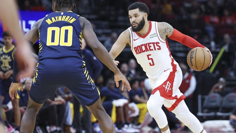 Oct 10, 2023; Houston, Texas, USA; Houston Rockets guard Fred VanVleet (5) dribbles the ball as Indiana Pacers guard Bennedict Mathurin (00) defends during the second quarter at Toyota Center. Mandatory Credit: Troy Taormina-USA TODAY Sports