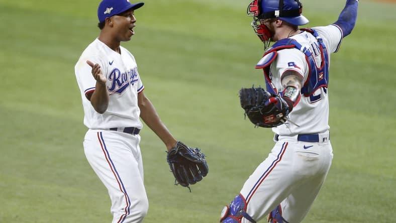 Oct 10, 2023; Arlington, Texas, USA; Texas Rangers relief pitcher Jose Leclerc (25) and catcher Jonah Heim (28) celebrate after defeating the Baltimore Orioles in game three of the ALDS for the 2023 MLB playoffs at Globe Life Field. Mandatory Credit: Andrew Dieb-USA TODAY Sports