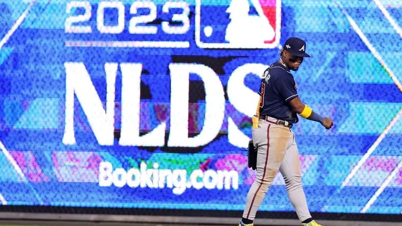 Oct 11, 2023; Philadelphia, Pennsylvania, USA; Atlanta Braves right fielder Ronald Acuna Jr. (13) reacts during the sixth inning against the Philadelphia Phillies in game three of the NLDS for the 2023 MLB playoffs at Citizens Bank Park. Mandatory Credit: Bill Streicher-USA TODAY Sports