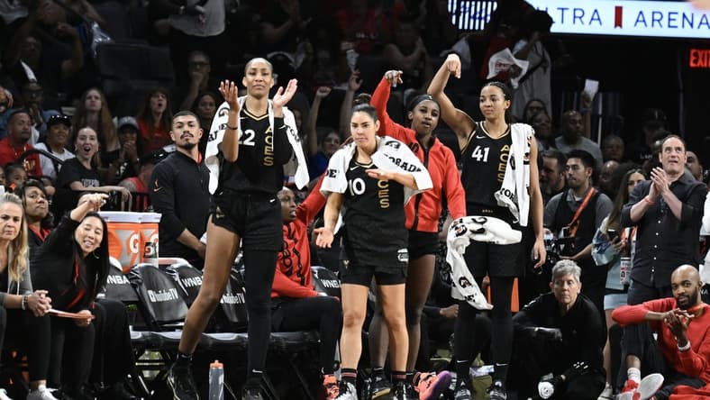 Oct 11, 2023; Las Vegas, Nevada, USA; Las Vegas Aces forward A'ja Wilson (22), guard Kelsey Plum (10), guard Jackie Young (0) and center Kiah Stokes (41) react to a play against the New York Liberty during the second half during game two of the 2023 WNBA Finals at Michelob Ultra Arena. Mandatory Credit: Candice Ward-USA TODAY Sports