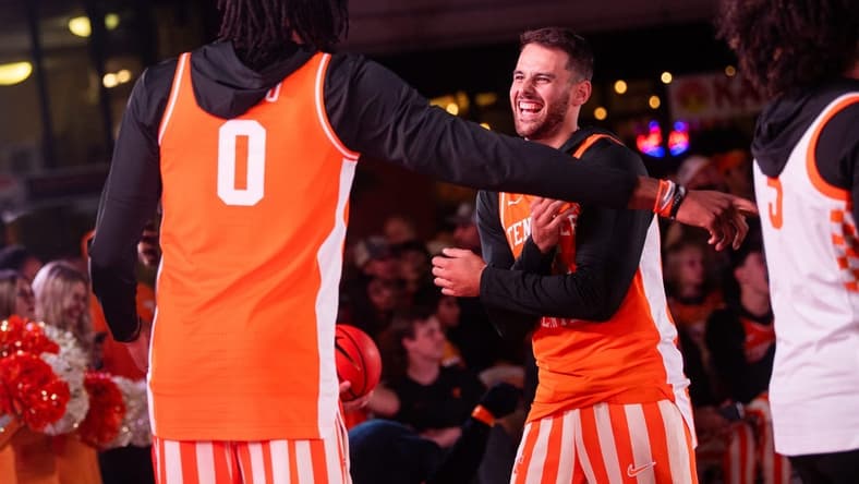 Tennessee's Santiago Vescovi (35) laughs with Jonas Aidoo (0) during the Market Square Madness preseason fan event for Tennessee men's and women's basketball held in downtown Knoxville's Market Square on Thursday, Oct. 12, 2023.