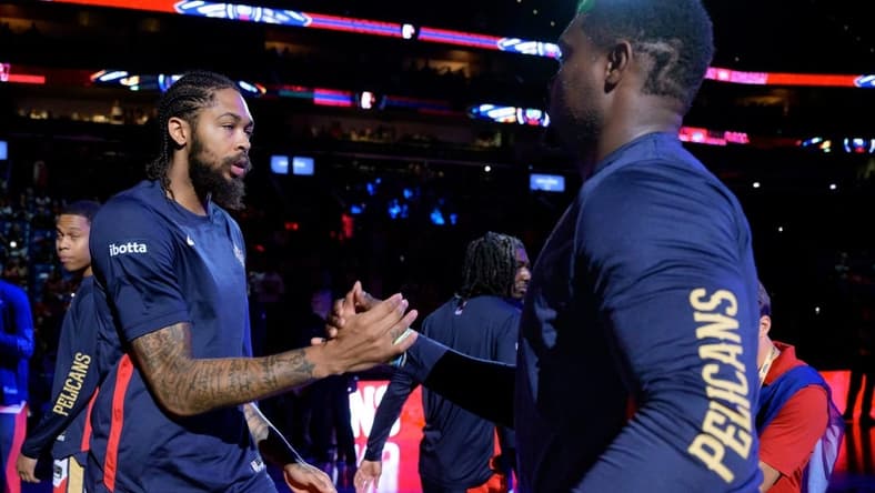 Oct 10, 2023; New Orleans, Louisiana, USA; New Orleans Pelicans forward Brandon Ingram, left, greets New Orleans Pelicans forward Zion Williamson during introductions before a game against the Orlando Magic at the Smoothie King Center. Mandatory Credit: Matthew Hinton-USA TODAY Sports