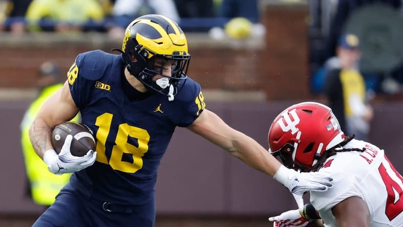 Oct 14, 2023; Ann Arbor, Michigan, USA; Michigan Wolverines tight end Colston Loveland (18) runs the ball in the first half against the Indiana Hoosiers at Michigan Stadium. Mandatory Credit: Rick Osentoski-USA TODAY Sports