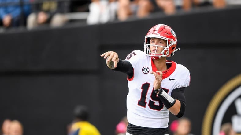 Oct 14, 2023; Nashville, Tennessee, USA;  Georgia Bulldogs quarterback Carson Beck (15) throws a pass against the Vanderbilt Commodores during the second half at FirstBank Stadium. Mandatory Credit: Steve Roberts-USA TODAY Sports