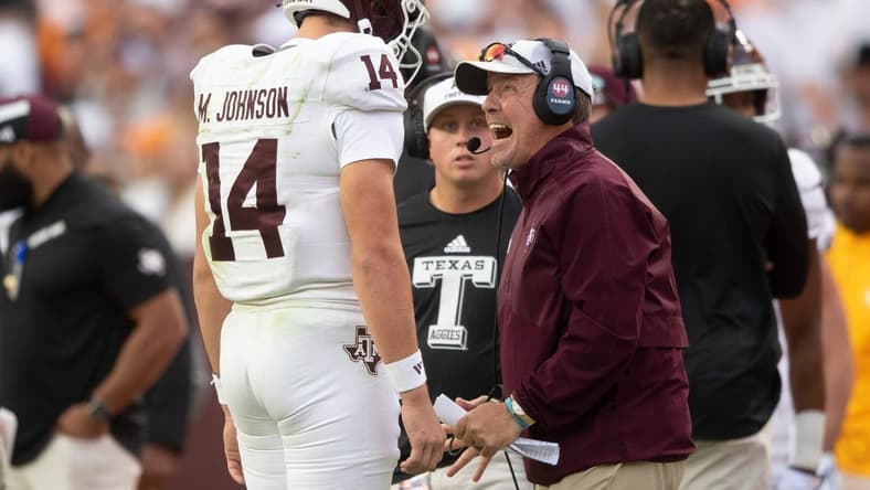 Oct 14, 2023; Knoxville, TN, USA; Texas A&M quarterback Max Johnson (14) talks with Texas A&M head coach Jimbo Fisher during a football game between Tennessee and Texas A&M at Neyland Stadium in Knoxville, Tenn., on Saturday, Oct. 14, 2023. Mandatory Credit: Brianna Paciorka-USA TODAY Sports
