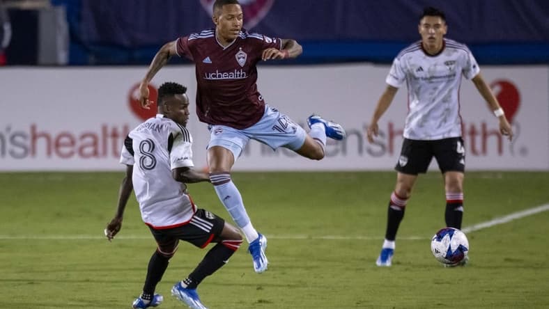 Oct 14, 2023; Frisco, TX, USA; Colorado Rapids forward Calvin Harris (14) leaps over FC Dallas forward Jader Obrian (8) during the first half at Toyota Stadium. Mandatory Credit: Jerome Miron-USA TODAY Sports
