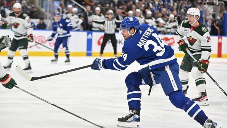 Oct 14, 2023; Toronto, Ontario, CAN;   Toronto Maple Leafs forward Auston Matthews (34) shoots the puck against the Minnesota Wild in the third period at Scotiabank Arena. Mandatory Credit: Dan Hamilton-USA TODAY Sports