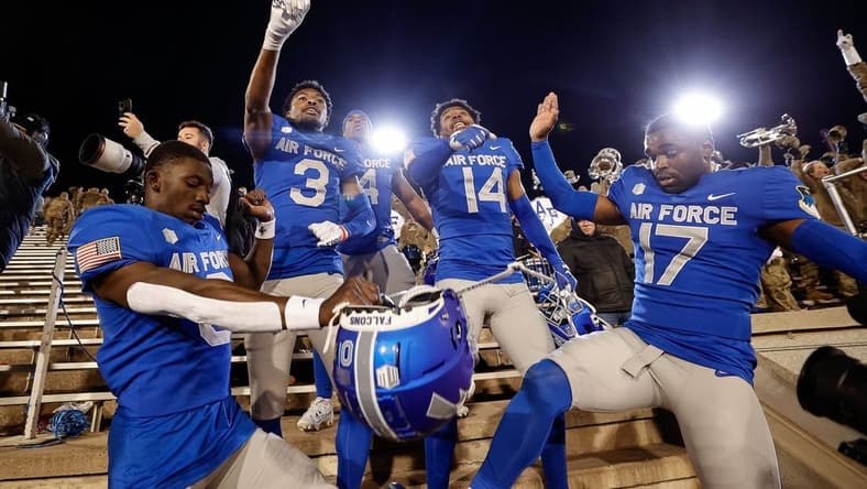 Oct 14, 2023; Colorado Springs, Colorado, USA; Air Force Falcons defensive back Trey Williams (0) and defensive back Jamari Bellamy (3) and fullback Emmanuel Michel (4) and defensive back K.C. Beard (14) and cornerback Zion Kelly (17) celebrate after the game against the Wyoming Cowboys at Falcon Stadium. Mandatory Credit: Isaiah J. Downing-USA TODAY Sports