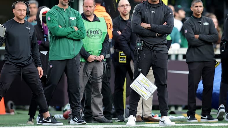 Oct 15, 2023; East Rutherford, New Jersey, USA; New York Jets injured quarterback Aaron Rodgers (left) and head coach Robert Saleh on the sidelines during the first quarter against the Philadelphia Eagles at MetLife Stadium. Mandatory Credit: Brad Penner-USA TODAY Sports