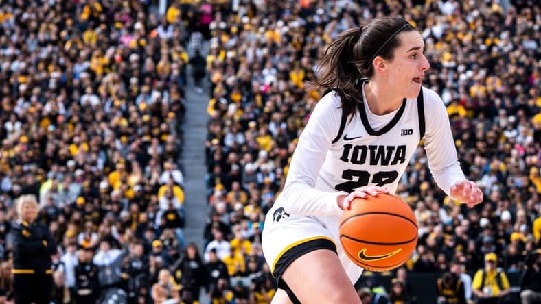 Iowa guard Caitlin Clark (22) drives to the basket during Crossover at Kinnick at Kinnick Stadium on Sunday, October 15, 2023 in Iowa City.