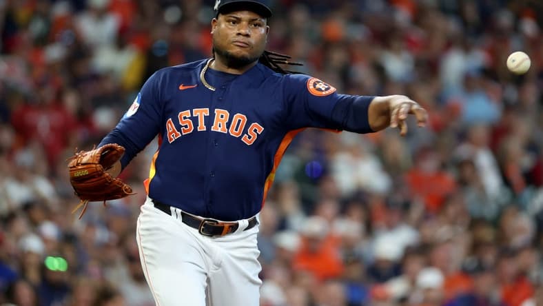 Oct 16, 2023; Houston, Texas, USA; Houston Astros starting pitcher Framber Valdez (59) throws to first base in the second inning against the Texas Rangers during game two of the ALCS for the 2023 MLB playoffs at Minute Maid Park. Mandatory Credit: Thomas Shea-USA TODAY Sports